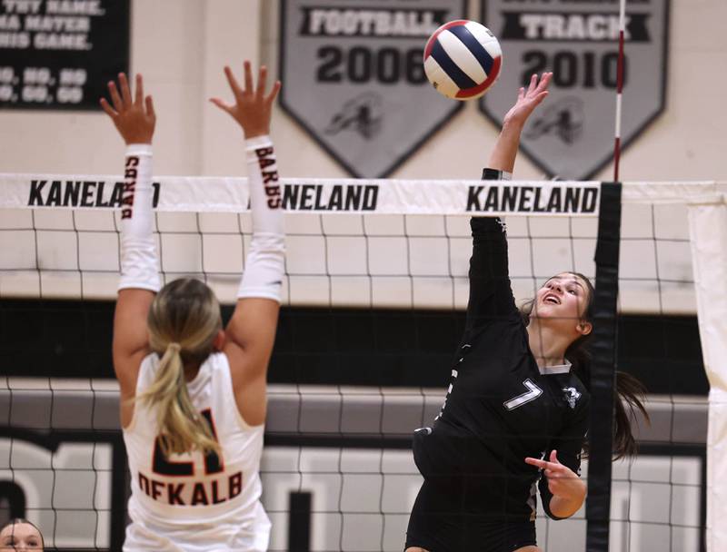 Kaneland's Brielle Gadomski tries to spike the ball by DeKalb's Maddi Hollar Thursday, Sept. 4, 2025, during their match at Kaneland High School in Maple Park.