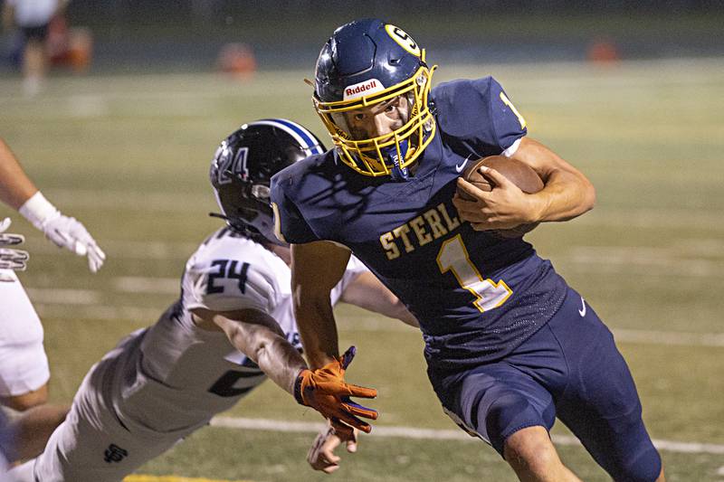 Sterling’s Joseph Holcomb turns the corner for a touchdown Friday, Sept. 1, 2023 against St Francis in a game at Sterling High School.