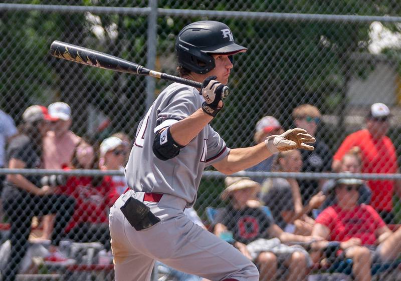 Plainfield North's Brandon Bak (20) drives in two runs on a double against Yorkville during the Class 4A Yorkville Regional baseball final at Yorkville High School on Saturday, May 28, 2022.