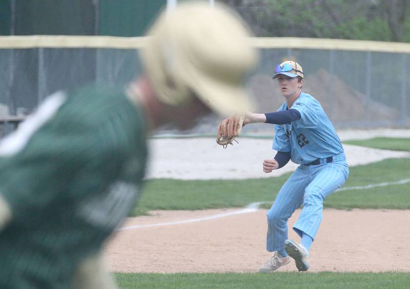 Marquette's third baseman Griffin Dobberstein throws out St. Bede's 19 at Masinelli Field on Thursday, April 18, 2024 in Ottawa.
