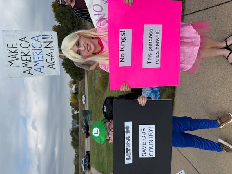 These two young people who came out for the Bolingbrook No Kings Day protest at the northeast corner of Janes Avenue and Boughton Road on Saturday, Oct. 18, 2025. The turnout was estimated to reach more than 1,000 as protesters extended all the way to the Interstate 355 intersection and lined both sides of Boughton Road.