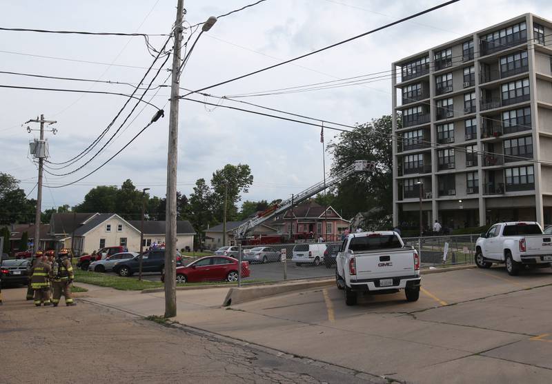 La Salle Firefighters (left) respond to a scene of a fire at the Housing Authority for La Salle County (Peru Hi-Rise) on Tuesday, June 17, 2025 in Peru. The fire happened shortly after 6p.m.