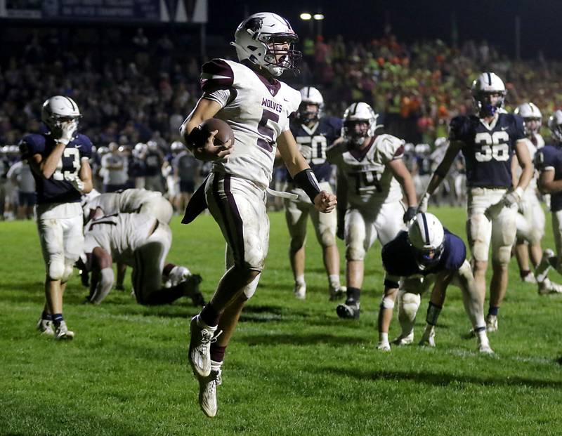 Prairie Ridge's Joseph Vanderwiel celebrates a fourth quarter touchdown to give Prairie Ridge the lead during a Fox Valley Conference football game against Cary-Grove on Friday, Sept. 22, 2023, at Cary-Grove High School in Cary.
