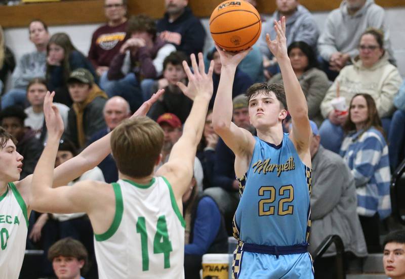 Marquette's Griffin Dobberstein shoots a jump shot over Seneca's Cameron Shriey during the Tri-County Conference championship on Friday, Jan. 31, 2025 at Putnam County High School.