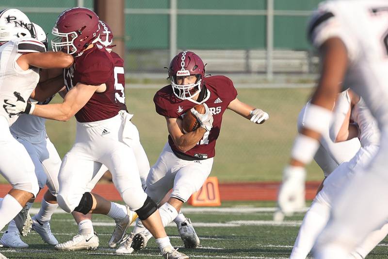Lockport’s Johnny Wesolowski finds a hole for the run against Plainfield North on Friday, August 30, 2024 in Lockport.