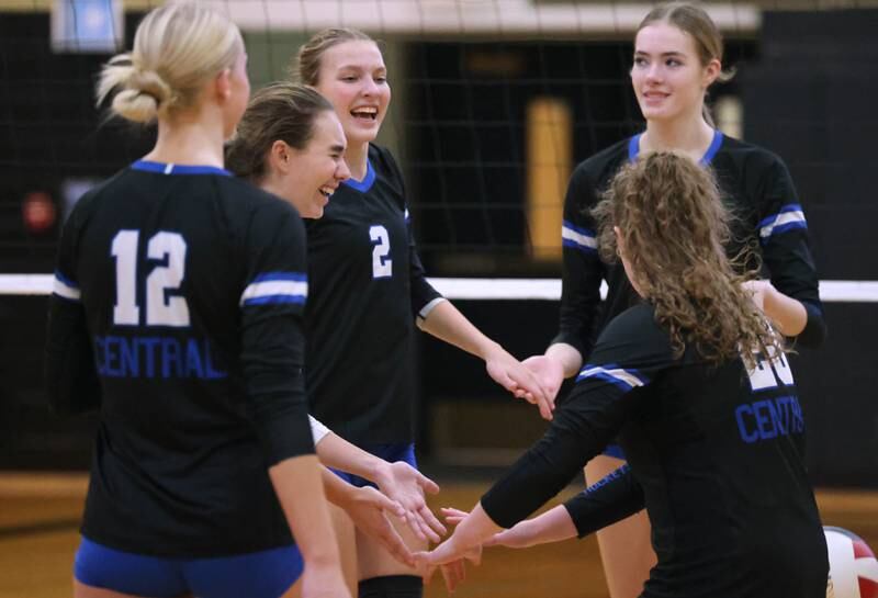 Burlington Central players celebrate a point against Sycamore Tuesday, Oct. 29, 2024, during their Class 3A regional match at Sycamore High School.