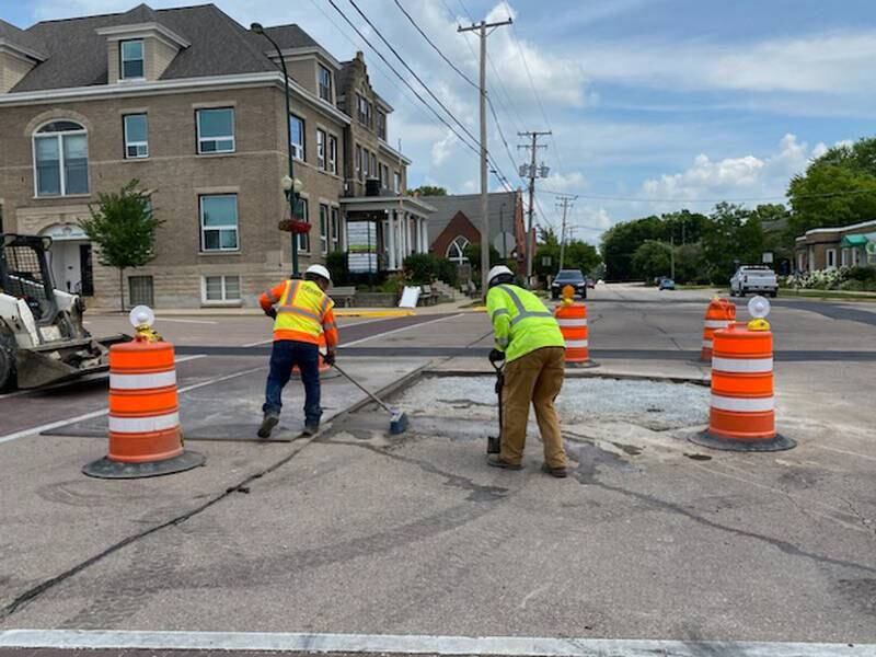 Crews work along DeKalb Avenue in Sycamore on Thursday, July 6, 2023. Water main and road work on DeKalb Avenue has been going on since mid-April 2023, with detours near downtown Sycamore at DeKalb Avenue and Cross Street.