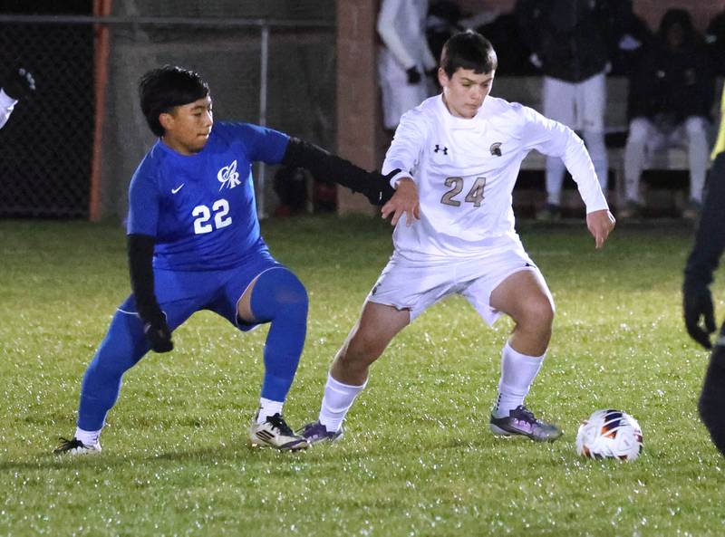 Burlington Central’s AJ Valladares (left) and Sycamore's Jaxson McPheters vie for a loose ball Tuesday, Oct. 21, 2025, during their IHSA Class 2A regional semifinal match at Burlington Central High School.
