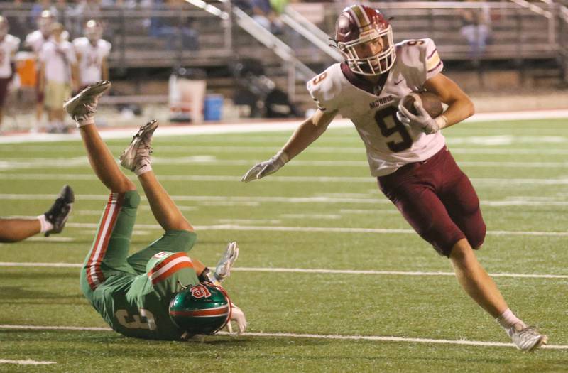 Morris's Caeden Curran runs in for the touchdown as L-P's Michael Hartman misses the tackle on Friday, Sept. 20, 2024 at Howard Fellows Stadium.