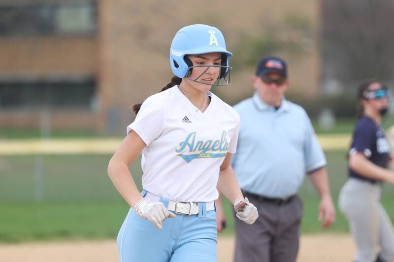 Joliet Catholic’s Addie Fanter heads to third on her three run home run against Plainfield South on Wednesday, April 10, 2024.