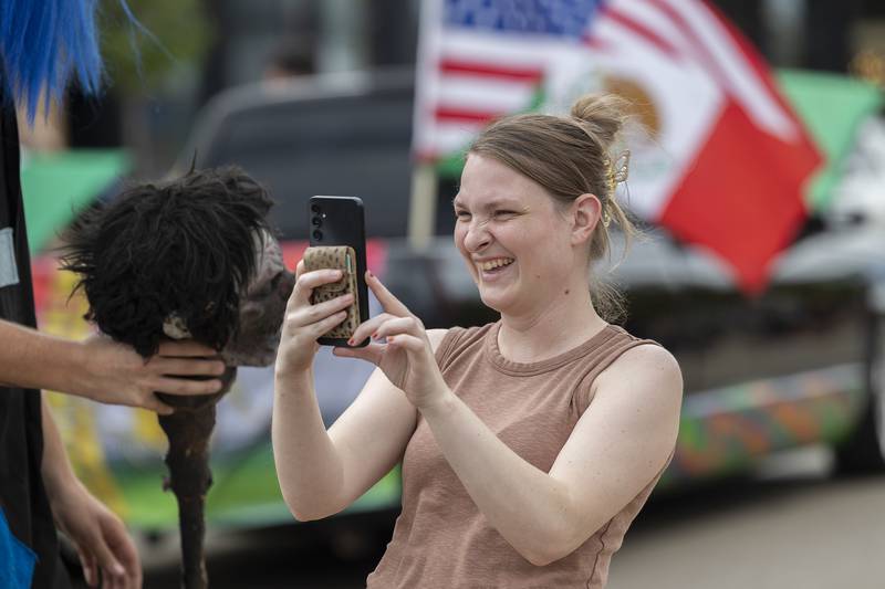 Jordan Wilson of Sterling snaps a picture during the Fiesta Parade Saturday, Sept. 20, 2025, in Sterling.