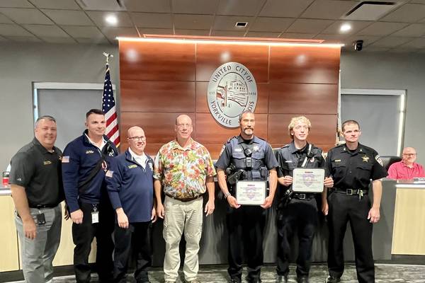 Yorkville police officer and fireman presented Lifesaving Award by the city