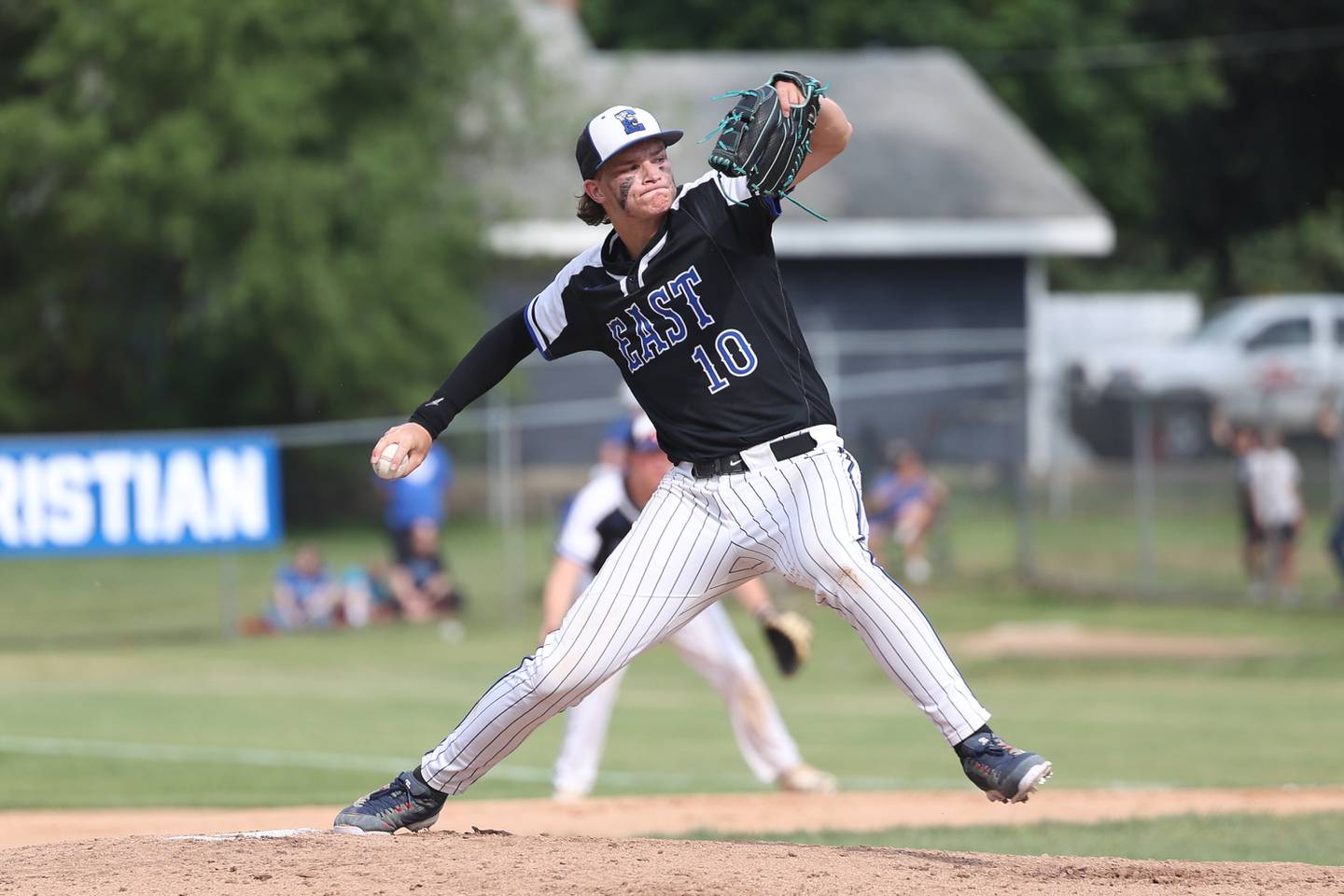 Lincoln-Way East’s Zach Kwasny delivers a pitch against Lincoln-Way West in the Class 4A Lockport Sectional semifinal on Thursday, June 1, 2023 in Lockport.
