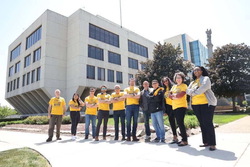 Members of the Courthouse Preservation Partnership pose for a photo outside the old Will County Courthouse on Thursday, May 25, 2023, in Joliet.