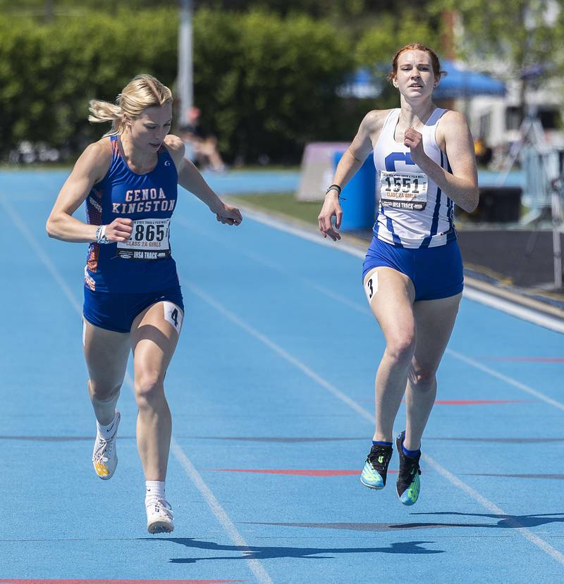 Genoa-Kingston’s Ellie Logsdon (right) and Burlington Central’s Paige Greenhagel battle it out in the 2A 400 run Saturday, May 20, 2023 during the IHSA state track and field finals at Eastern Illinois University in Charleston.