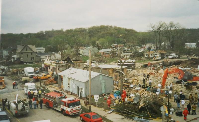 Crews work the scene of where the Milestone Tap once stood Wednesday April 21, 2004 downtown Utica.