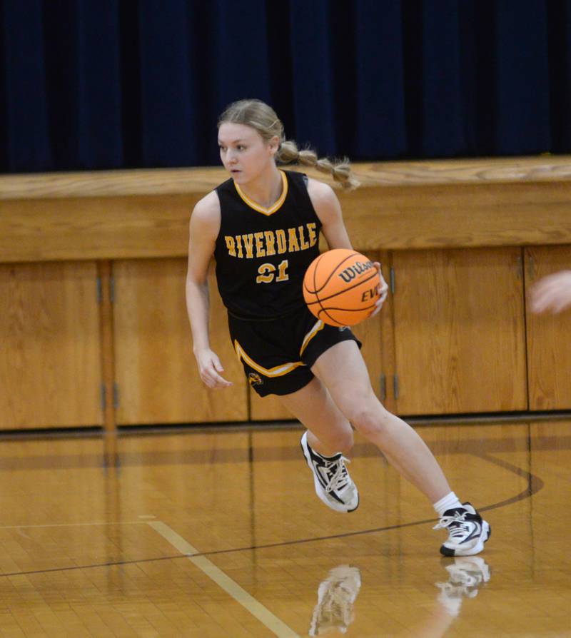 Riverdale's Cayleigh Hungate dribbles against Polo during a Saturday, Jan. 18, 2025 game at Polo High School.