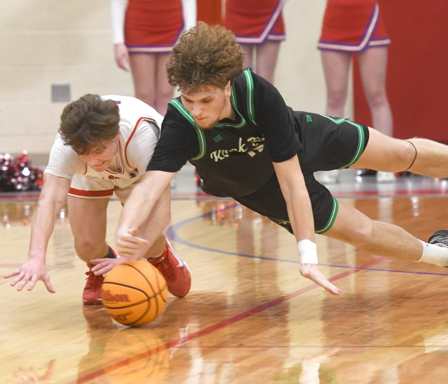 Oregon's Cooper Johnson (2) and Rock Falls' Cole Munix (12) dive for a loose ball on Friday, Jan. 9, 2026 at the Blackhawk Center in Oregon.