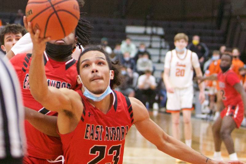 East Aurora's Jullian Acosta goes for the loose ball against St. Charle East at the 62ND Annual Ron Johnson Thanksgiving Tournament on Nov.22, 2021 in St. Charles.