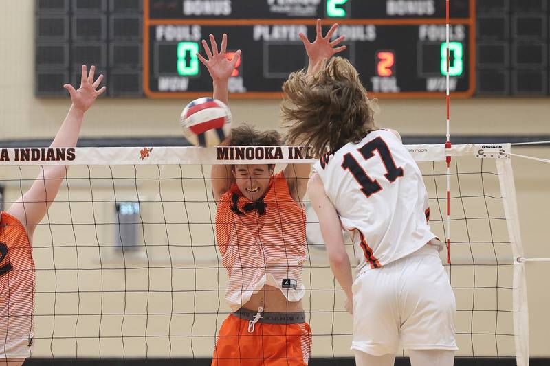 Minooka’s Connor Latta gets the point off a block against Lincoln-Way West on Monday, April 8, 2024.