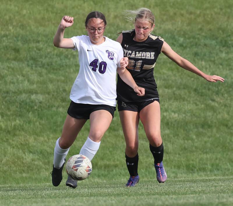 Dixon’s Rachel Lance and Sycamore's Kelsie Ryder try to win possession during their game Thursday May 15, 2025, at Sycamore High School.