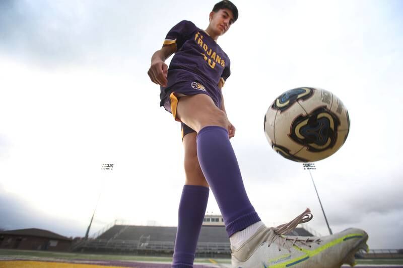 Mendota's Johan Cortez performs toe touches for a photo on Wednesday, Nov. 20, 2024 at Mendota High School. Cortez is the 2024 NewsTribune boys soccer player of the year.