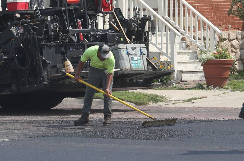 Crews with Advanced Asphalt pave the entrance to the Princeton Train Depot on Monday, Aug. 5, 2024. In May, The Princeton City Council approved a $542,952 agreement with Advanced Asphalt to complete the work.The parking lot is expected to open later this month.