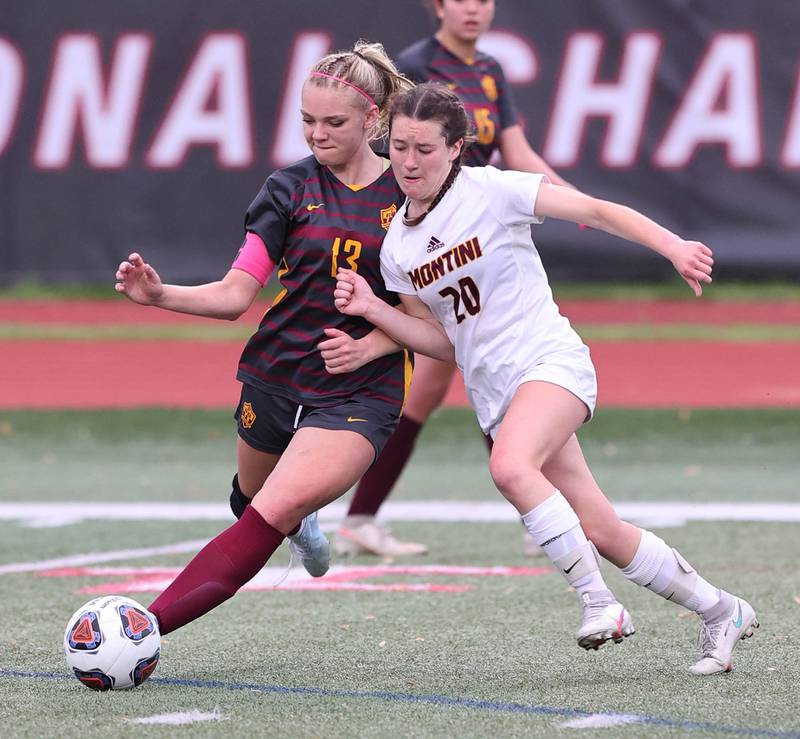 Richmond-Burton's Jordan Otto (left) and Montini's Jillian Parrilli collide at the ball Friday, May 27, 2022, during their IHSA Class 1A state semifinal game at North Central College in Naperville.