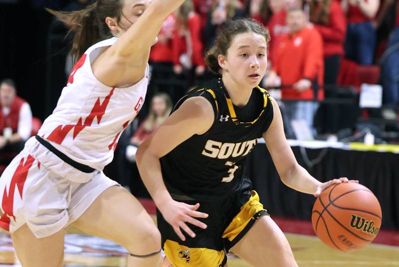 Hinsdale South's Brynn Diedrich dribbles by a Glenwood defender during their game Friday, March 1, 2024, in the IHSA Class 3A state semifinal at the CEFCU Arena at Illinois State University in Normal.