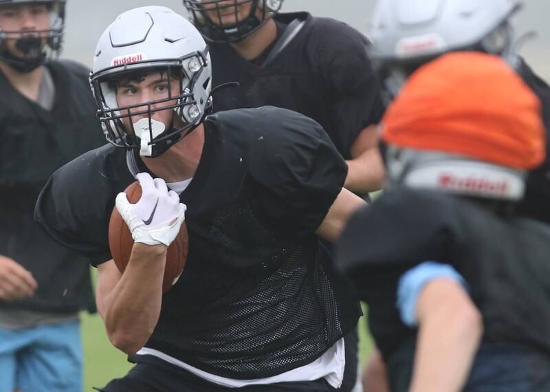 Kaneland’s Josh Mauthe looks to make a move on a defender during practice Wednesday, Aug. 9, 2023, at the school in Maple Park.