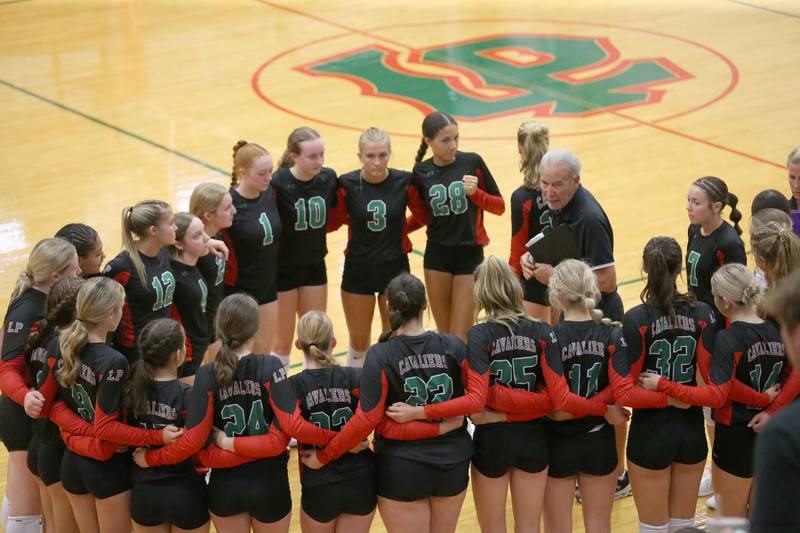 L-P head volleyball coach Mark Haberkorn huddles with his team while playing Princeton on Tuesday, Aug. 22, 2023 in Sellett Gymnasium.