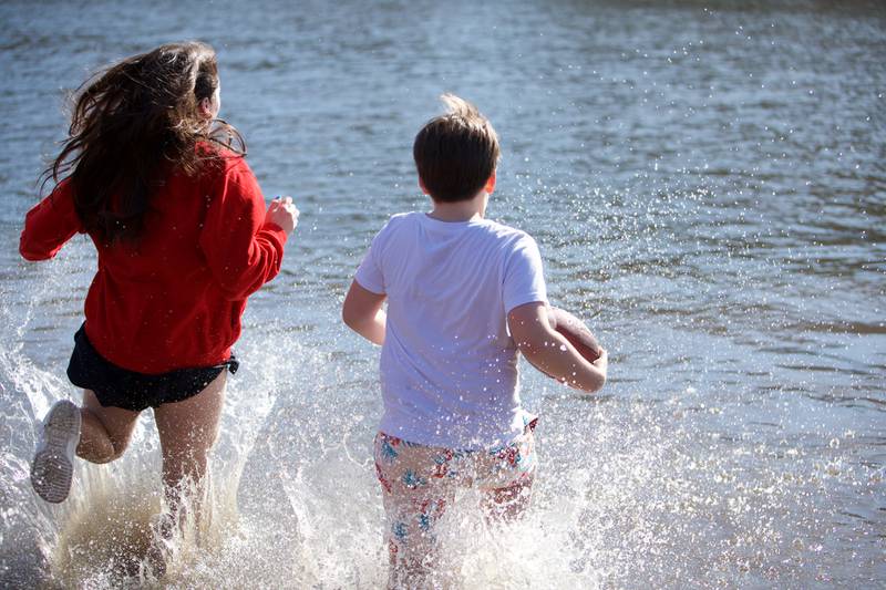Locals take the plunge at the St. Charles Police and Fire Annual Polar Plunge at Ferson Creek Park on Sunday, March 9,2025 in St. Charles.
