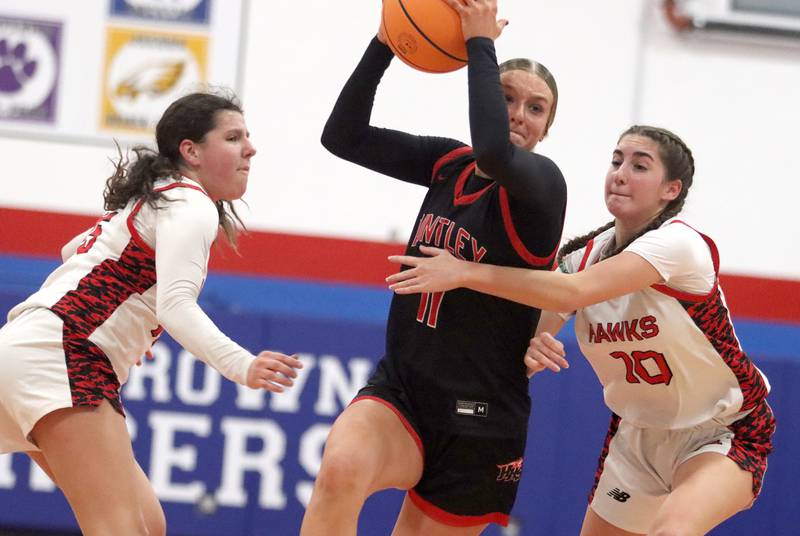 Huntley’s Anna Campanelli works under the hoop against Maine South in Komaromy Holiday Classic varsity girls basketball championship game action on Monday, Dec. 30, 2024, at Dundee-Crown High School in Carpentersville.