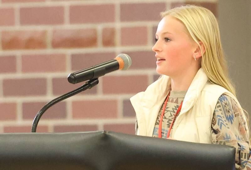 Emcee Emma Fitzpatrick, a student at Parkside Middle School welcomes students, staff and visitors during a Veterans Day program on Tuesday, Nov. 11, 2025 in Peru.