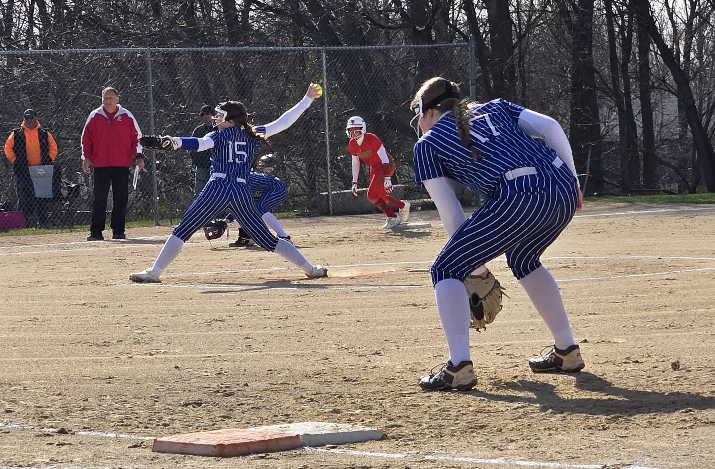 Newark's Cayla Pottinger fires a pitch to a La Salle-Peru batter in Tuesday's game at Newark.