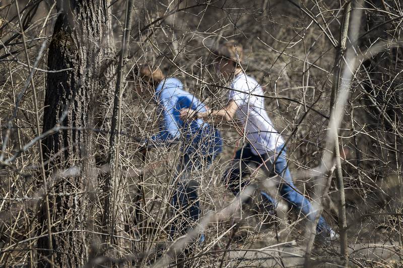 A pair of boys sprint through Franklin Creek State Park Saturday, March 21, 2026. A warm Saturday brought locals outside to enjoy the mild weather.
