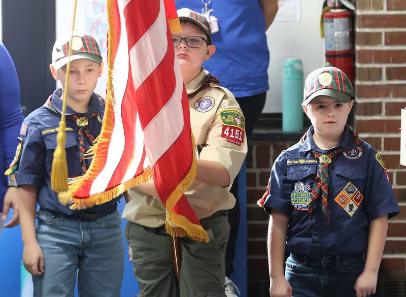 Cub Scouts Carver Smith, Tyson Swan and Ryne Chlum carry the American Flag after presenting the colors during the Veterans Day program at Lincoln School on Tuesday, Nov. 11, 2025 in Princeton.