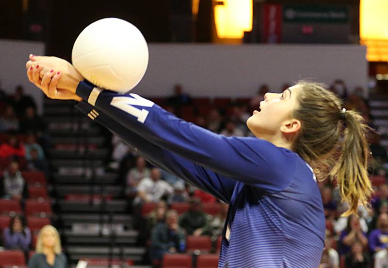 Nazareth Academy's Jane Manecke hits the ball to the Taylorville side in the Class 3A semifinal game on Friday, Nov. 11, 2022 at Redbird Arena in Normal.