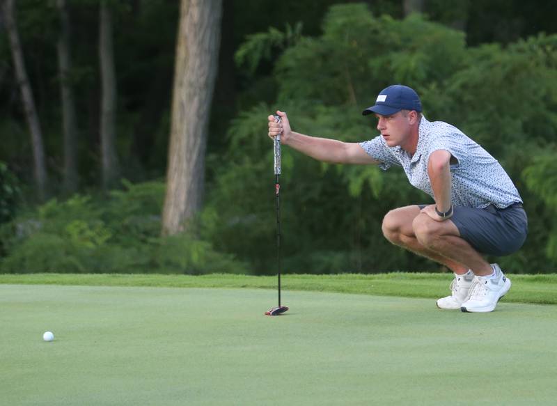 Caleb Dzierzynski lines up a put during the Illinois Valley Mens Golf Championship Tournament on Sunday, July 27, 2025 at Spring Creek Golf Course in Spring Valley.