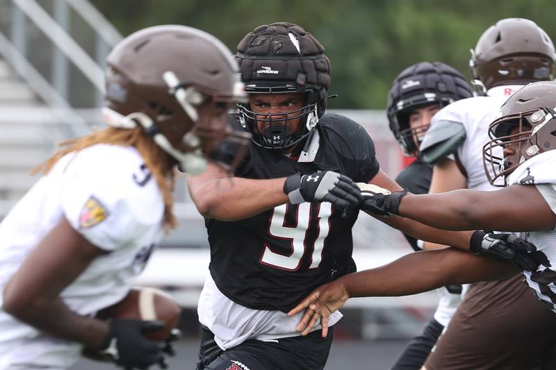 Plainfield North’s Andre Deal sheds a blocker during a scrimmage against Joliet Catholic on Thursday, July 13th, 2023 at Plainfield North