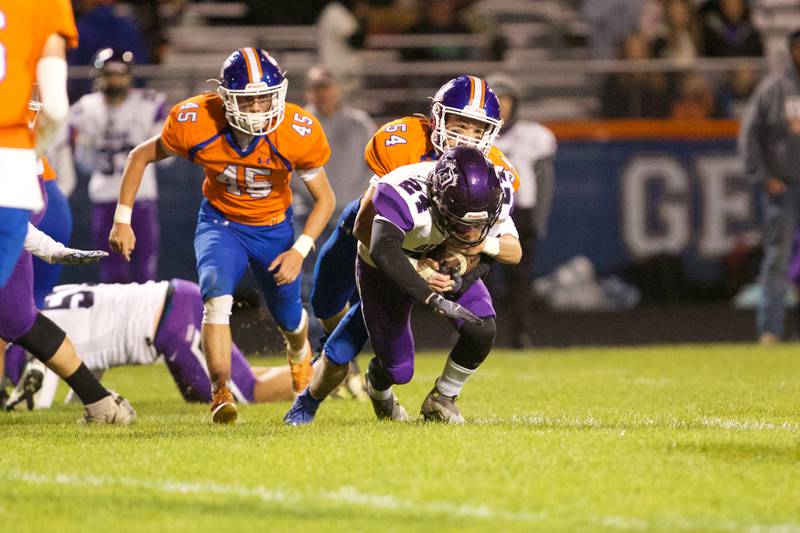 Dixon's Hunter Vacek is tackled by Genoa - Kingston's Connor Grimm on Friday Oct.7,2022 in Genoa.