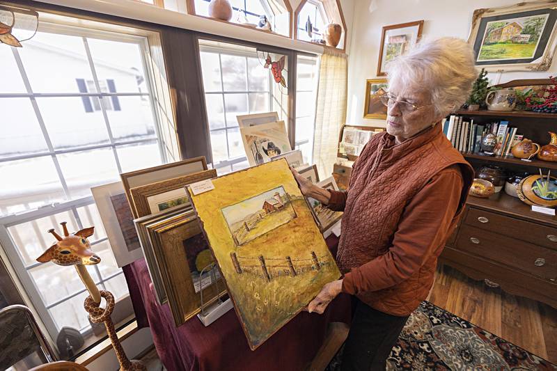 Jan Harvey shows off one of the pieces she’ll have for sale from her home Dec. 1 and 2. Harvey is teaming up with Beverly Garcia to show and sell their art pieces.