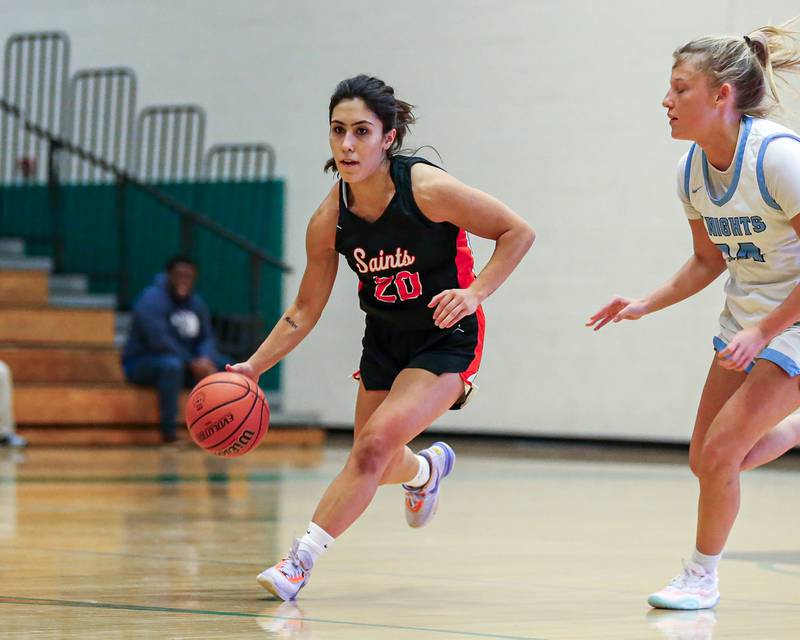 St Charles East's Alexis Maridis (20) advances the ball in their game vs Prospect at the York Thanksgiving Tournament. Nov 13, 2023.
