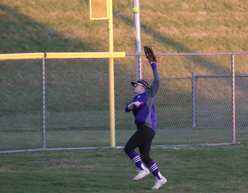 Plano's Lainey Lemke runs back to the fence as the ball soars over her head against Ottawa on Thursday, April 6, 2023 at King Field in Ottawa.