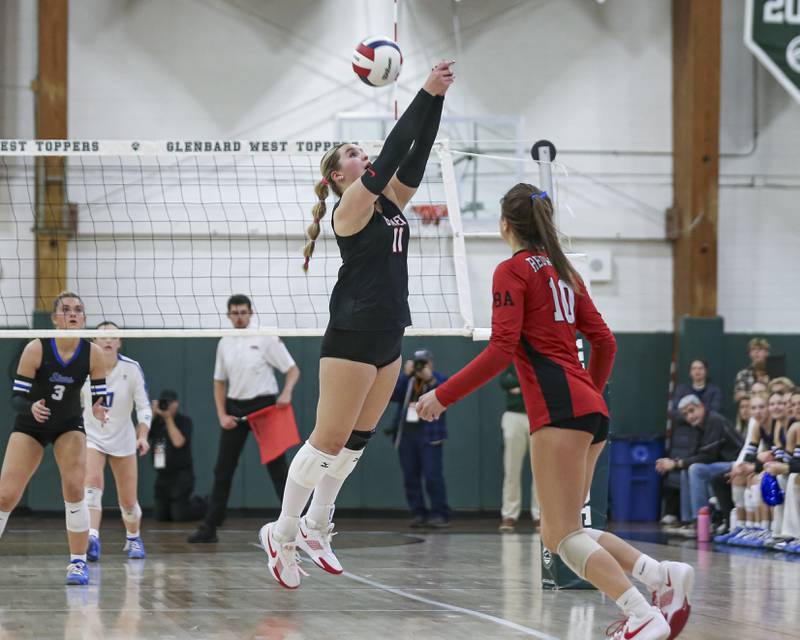 Benet's Ellie Stiernagle (11) digs out a shot during Class 4A Glenbard West Sectional final volleyball match between St Charles North at Benet. Nov 6, 2025 in Glen Ellyn.