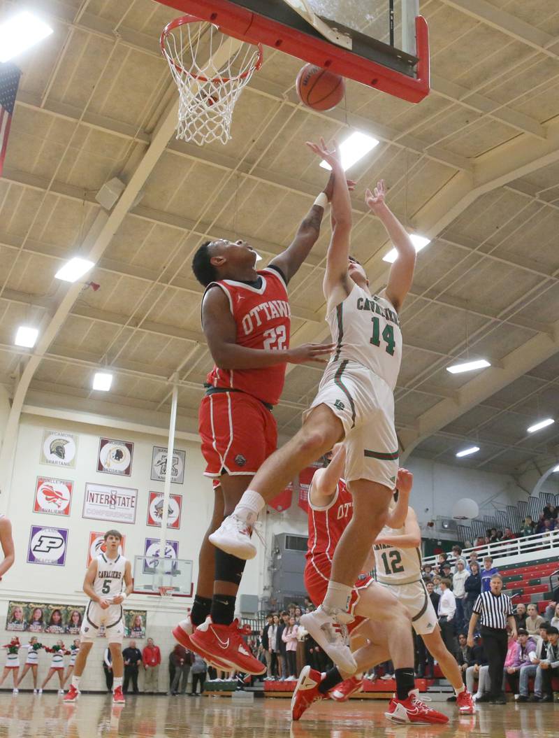 L-P's Brendan Boudreau scores a bucket over Ottawa's Tristan Finley on Friday, Jan. 5, 2024 at Sellett Gymnasium.