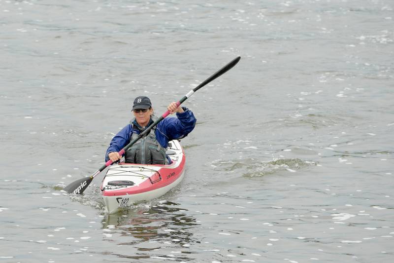 A kayak racer paddles down the Fox River in Batavia during the annual Mid-American Canoe & Kayak on Saturday, June 1, 2024.