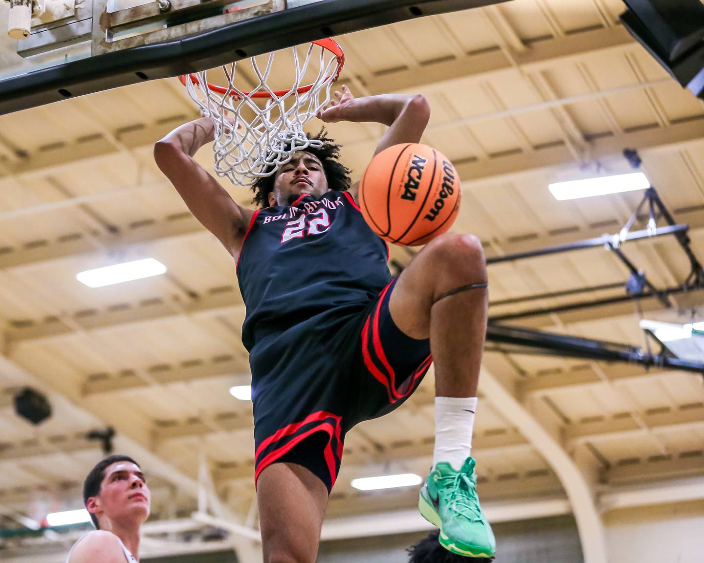 Bolingbrook's Joshua Pettigrew (22) dunks during their Jack Tosh Holiday Classic basketball tournament game between Bolingbrook at Glenbrook South. Friday Dec 27, 2024 in Elmhurst.