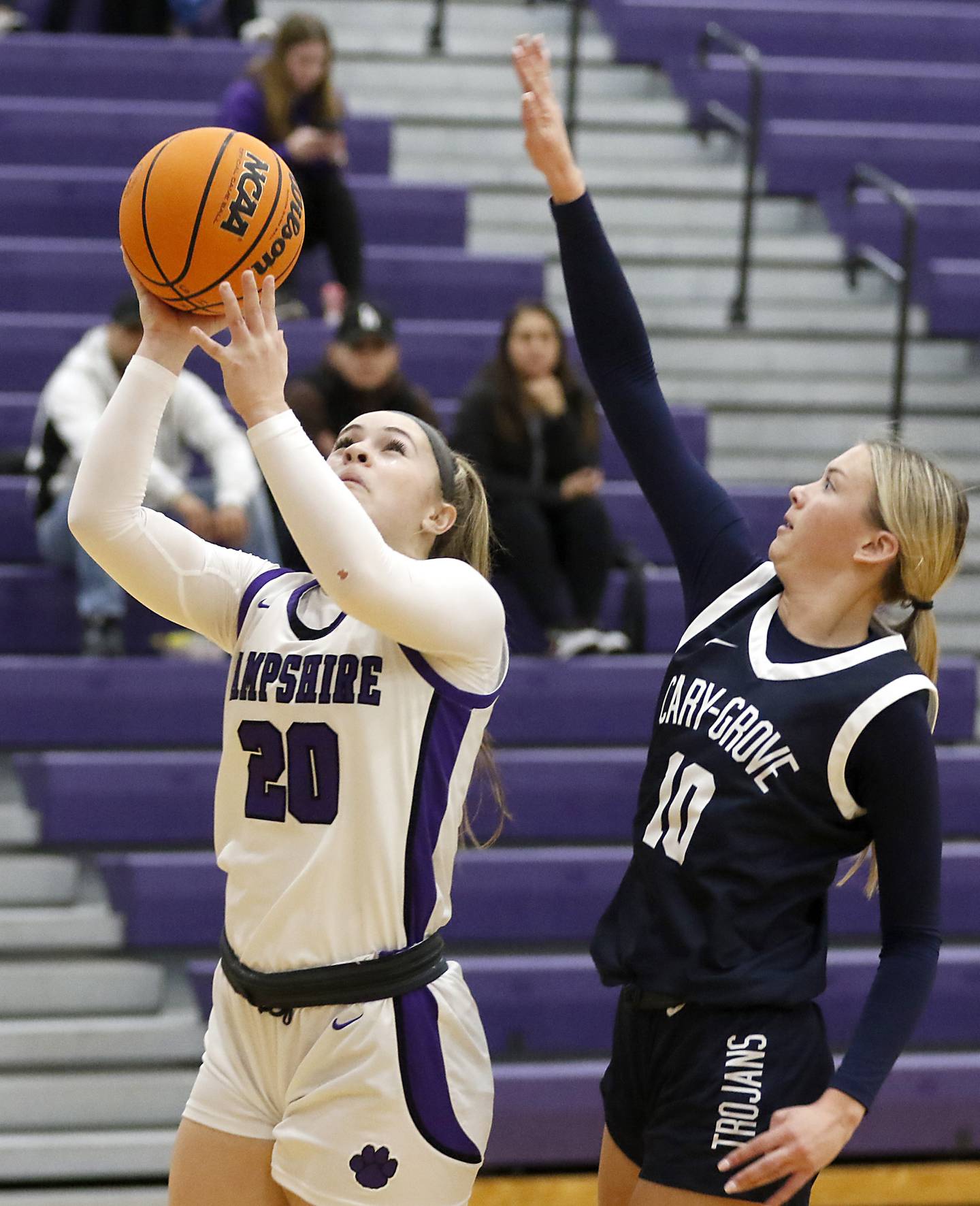 Hampshire's Chloe Van Horn drives to the basket in front of Cary-Grove's Alivia Nielsen during a Fox Valley Conference girls basketball game on Monday, Dec. 9, 2024, at Hampshire High School.