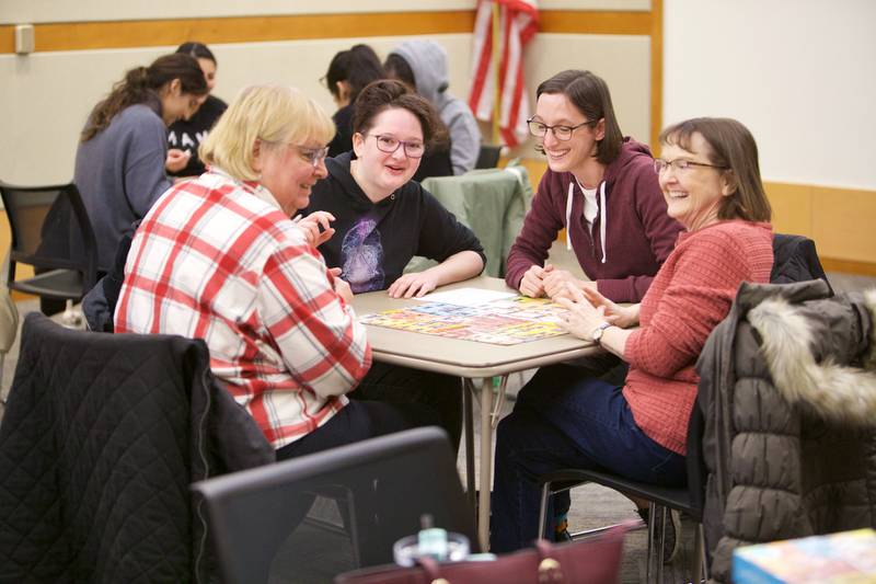 Teams compete in a 500 piece puzzle speed race competition on Saturday, Jan. 27,2024 at the Elmhurst Library in Elmhurst.